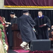 11Middlesboro site graduate Sam Johnson accepts his diploma from Dr. Kraska, Cha