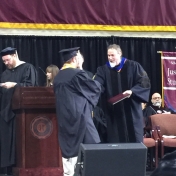 2Corbin campus graduate Michael Strickland accepts his diploma from Dr. Kraska, 