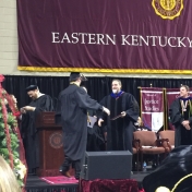 8Manchester campus graduate Madison Reed accepts his diploma from Dr. Kraska, Ch