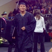 Bertha Sebastian heads back to her seat after receiving her diploma 12/2014.