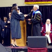 Danielle Fox, Manchester campus accepts her diploma from Dean Ault 12-2014.