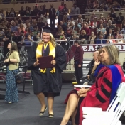 Hazard Regional Campus student Stephanie Combs returns to her seat after accepting her diploma at the CJS Commencement 5-16-15