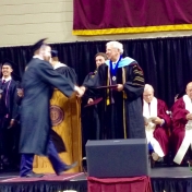 James Disney accepts his diploma from Dean Ault 12/2014.