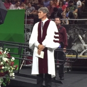 Regional Campus CJ Corrdinator Stephen Kappeler prepares to lead students off stage at the CJS Commencement ceremony 5-16-15