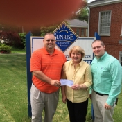 Regional Campuses' APS & LAE student organizations' Mr. Skyler Tylor Mills and Mr. Russell McKay present $250.00 check to Mrs. Mary Schild Director of Sunrise Children Services 5-12-15.